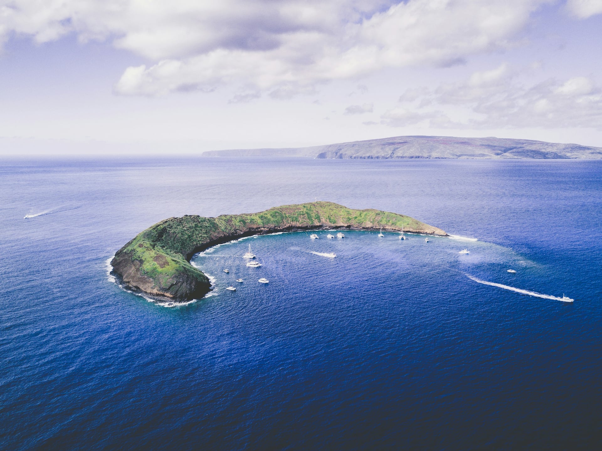 Snorkeling boats inside Molokini’s crescent, Maui